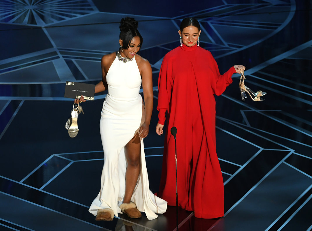 HOLLYWOOD, CA - MARCH 04: Actors Tiffany Haddish (L) and Maya Rudolph speak onstage during the 90th Annual Academy Awards at the Dolby Theatre at Hollywood & Highland Center on March 4, 2018 in Hollywood, California. (Photo by Kevin Winter/Getty Images)