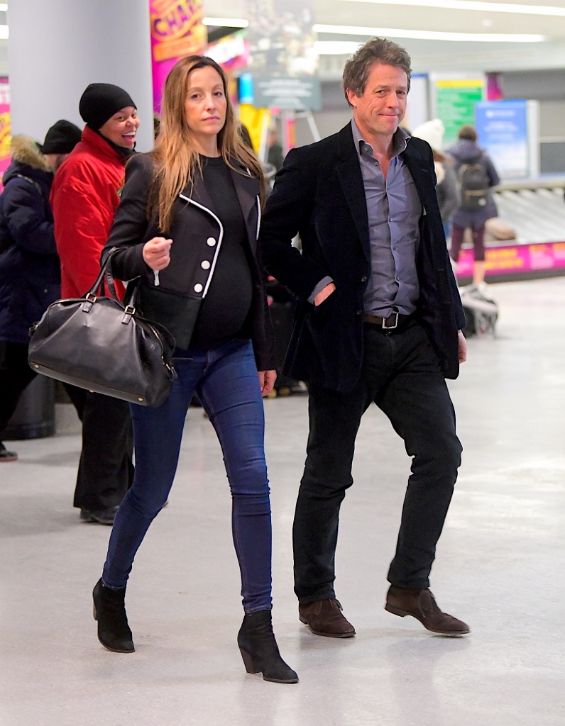 EXCLUSIVE: Hugh Grant was spotted touching down in NYC alongside his pregnant girlfriend, Anna Eberstein. The couple attended the Golden Globes on Sunday in a rare public outing , but as they landed back in the Big Apple, Hugh committed a major fashion faux pas, as he recycled the same exact outfit he wore to dinner 2 days before in LA. He appeared disheveled and tired as they walked through the terminal . Pictured: Hugh Grant, Anna Eberstein Ref: SPL1643862 080118 EXCLUSIVE Picture by: 247PAPS.TV / Splash News Splash News and Pictures Los Angeles:310-821-2666 New York:212-619-2666 London:870-934-2666 photodesk@splashnews.com