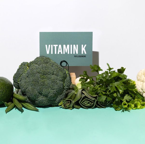 A set of natural products rich in vitamin K. Healthy food concept. Cardboard sign with the inscription.