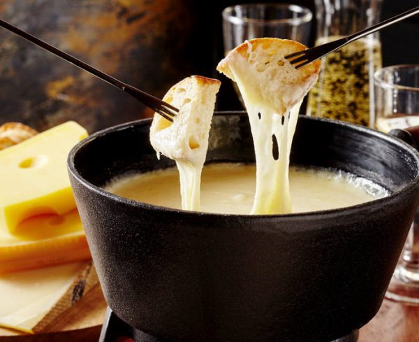 Gourmet Swiss fondue dinner on a winter evening