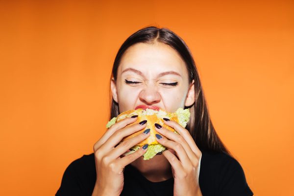 young girl wants to lose weight, but eats a harmful hamburger