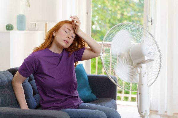 One woman suffering for summer heatwave at home